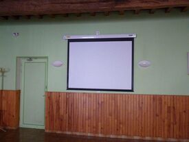 Installation d'un écran de projection salle Padovani
